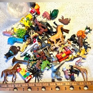 Mixed lot of small toys in collector circus bottles and plastic jar